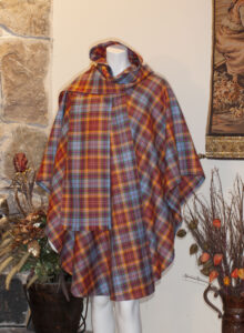 Inverleith Cape A beautiful, stylish 3 quarter length cape with built in scarf and hood; this model is not lined